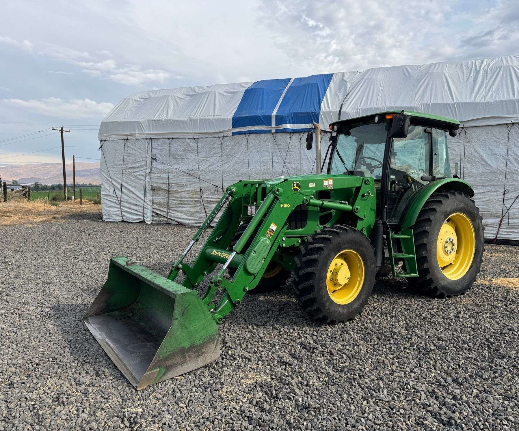 2011 John Deere 6115D